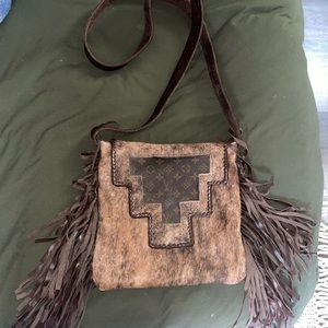 Cowhide and Louis Vuitton crossbody fringe purse